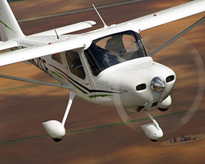 A high-wing airplane in flight